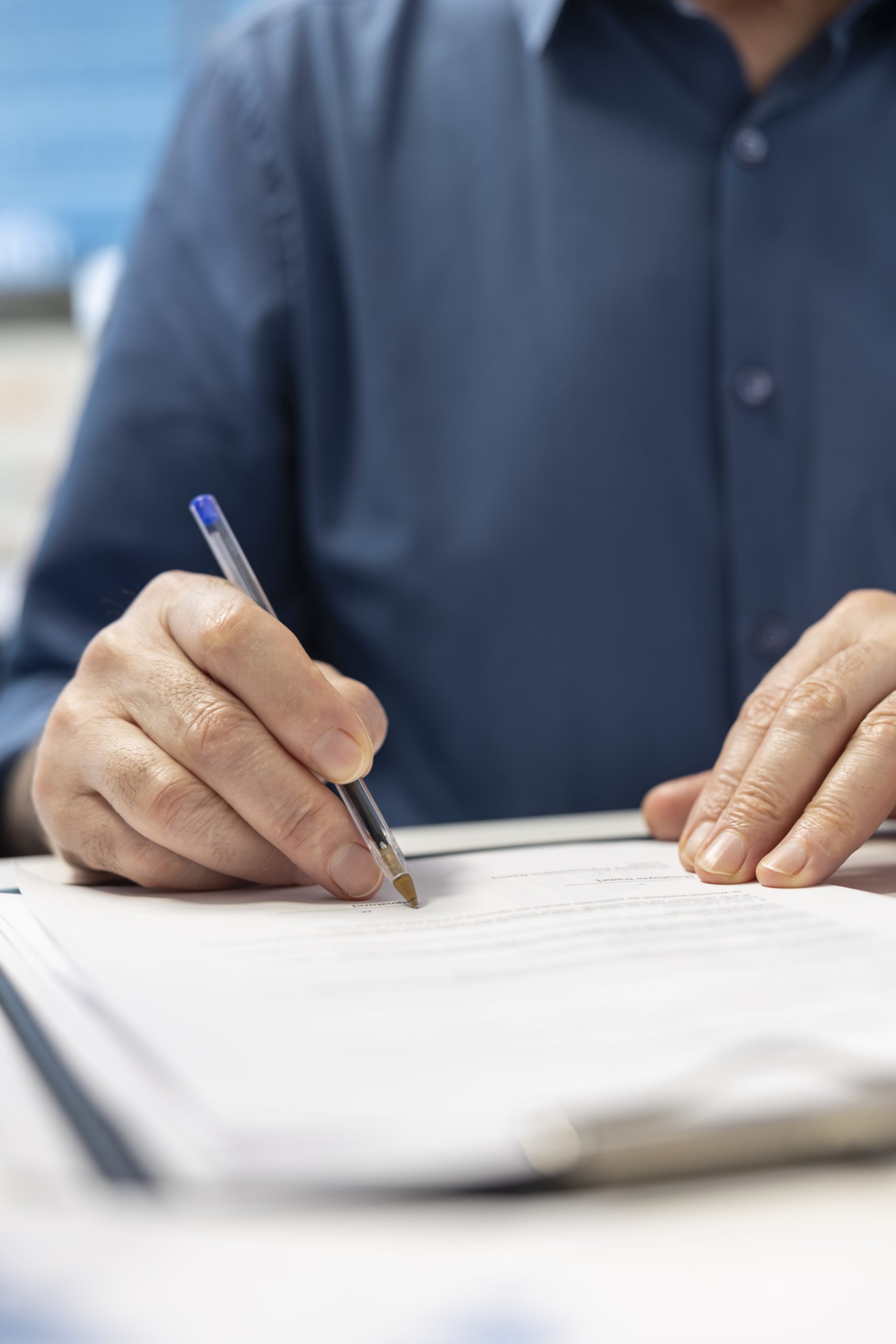 senior man signing financial contract with advisor expert